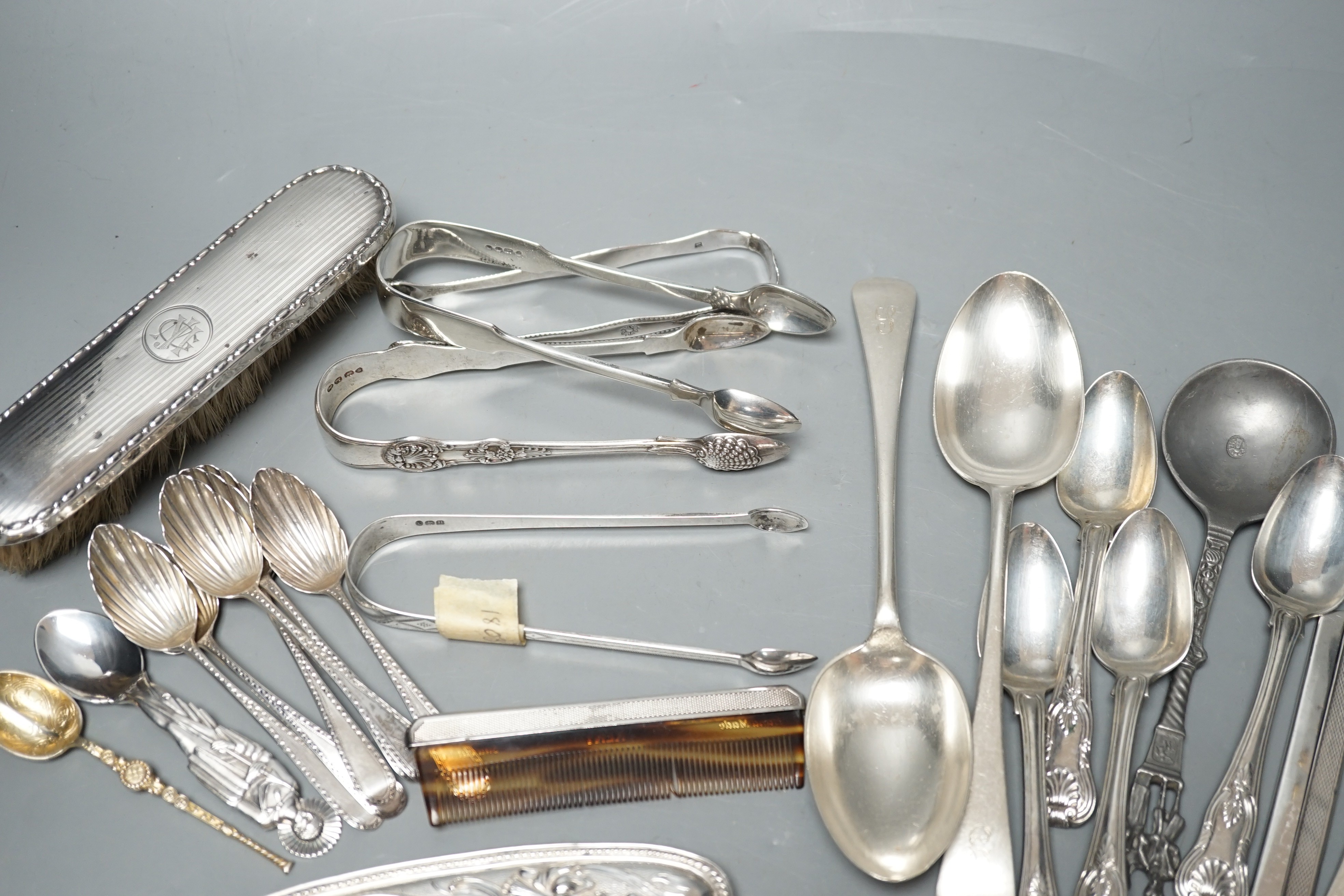 A small quantity of assorted silver flatware including a set of six teaspoons, by Peter, Ann & William Bateman, London, 1800, a pair of Victorian tablespoons, three pairs of silver sugar tongs etc. and a pewter spoon and